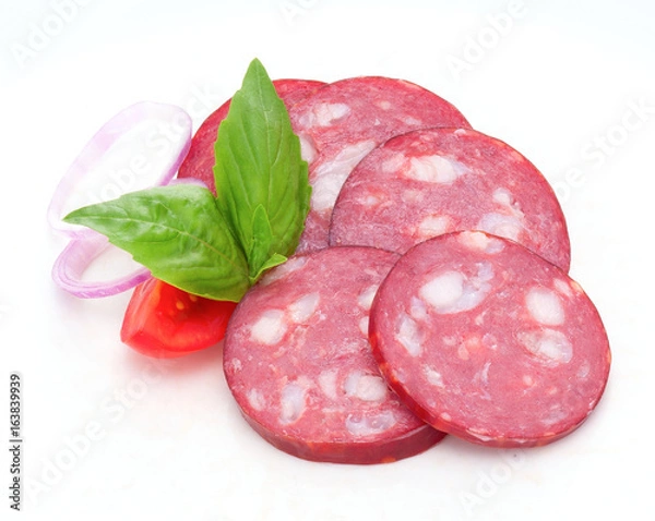 Obraz Few slices of smoked boiled sausage with tomatoes, onion and basil. Closeup