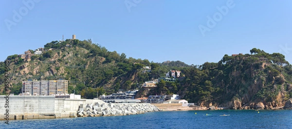 Fototapeta Panoramic view towards Blanes port location from the sea, Catalonia.