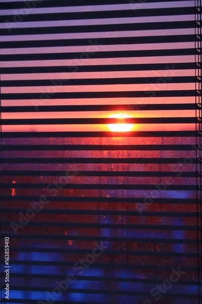 Obraz sunset looking through jalousie