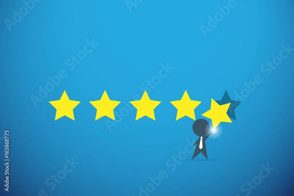 Obraz businessman holding gold star for rating, quality and business concept