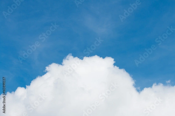 Fototapeta Beautiful blue sky background with tiny clouds