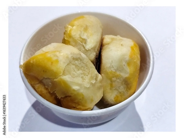 Fototapeta Bakpia is a cake made from a mixture of green beans and sugar which is coated in flour and shaped into flat rounds, then baked. Bakpia is a typical food from Yogyakarta, Indonesia