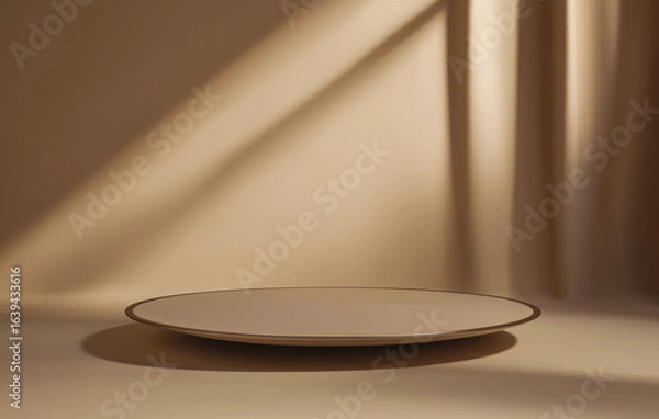 Fototapeta Simple beige podium for product display is set against warm, softly lit background, creating serene and elegant atmosphere. smooth surface and subtle shadows enhance minimalist design