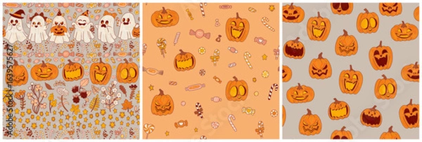 Fototapeta Three festive Halloween patterns set. Funny pumpkins and sweets. Caramels, sweets and lollipop canes with orange autumn leaves.