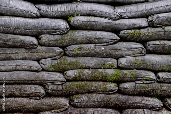Obraz Sandbag bunker texture or Sandbags for flood protection texture background of the old military
