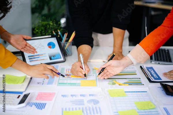 Fototapeta Business team collaboration discussing working analyzing with financial data and marketing growth report graph in team, presentation and digital tablet, laptop