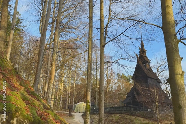Obraz Charming wooden church nestled among tall trees in a serene forest setting, Fantoft Stave Church, the Fana borough of Bergen, Norway