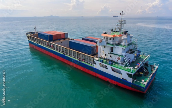 Obraz container ship in import export and business logistic.By crane ,Trade Port , Shipping.cargo to harbor.Aerial view.Top view.