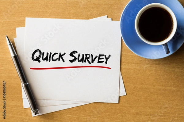 Fototapeta Quick survey - handwriting on papers with cup of coffee and pen, concept