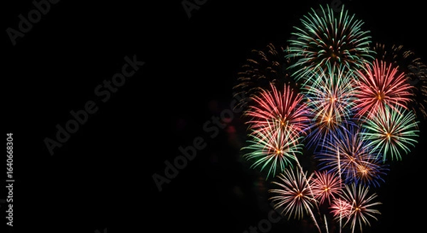 Fototapeta Cluster of fireworks with green and red bursts, AI generated	