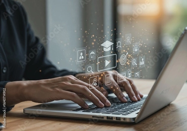 Fototapeta Online Education: Person Typing on Laptop with E-Learning Icons and Graduation Cap.