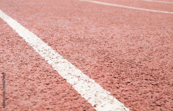 Obraz surface of the red running track in the stadium on top view for copy space emtry background.