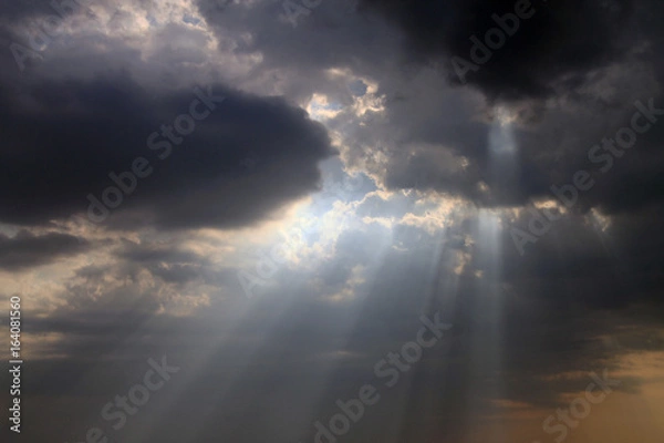 Fototapeta Beautiful sky with blue sun rays and dynamic clouds