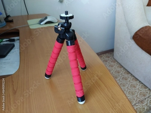 Fototapeta Red color tripod on the table
