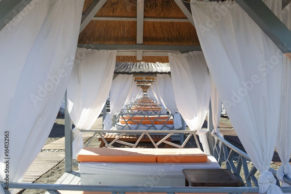 Fototapeta Lounger bed, on the beach