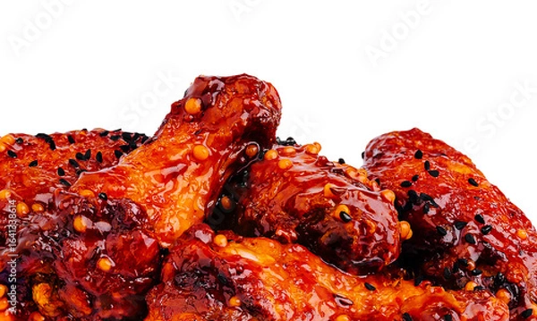Obraz Succulent chicken wings coated in spicy sauce on a white background