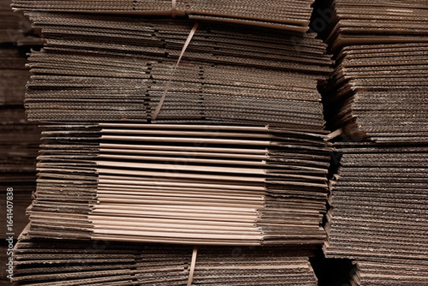 Fototapeta Stacks of cardboard sheets ready for recycling or packaging use