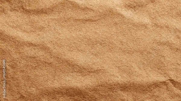 Fototapeta blank kraft paper surface in warm brown tones with soft natural shadows. Clean simple eco-friendly background ready for overlay.