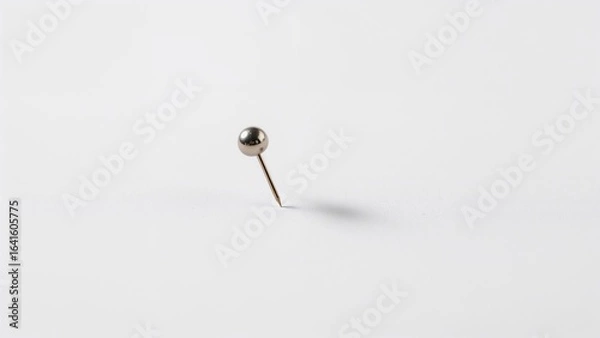 Fototapeta Close-up image of a white note attached by a pin on a neutral background, illustrating business stationery and concepts