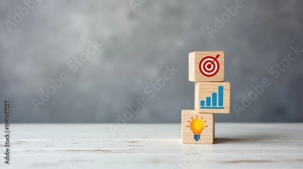 Obraz The Business Strategy - A stack of wooden blocks with icons for a target, graph, and lightbulb, symbolizing a strategic business plan and innovation