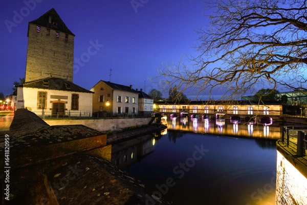Fototapeta Barrage Vauban illuminated at dusk in Strasbourg