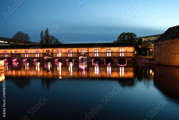 Fototapeta Barrage Vauban illuminated at dusk in Strasbourg