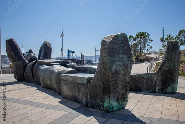Obraz Monumental sculpture of Atlantis, a Greek god of the Atlantic Ocean, lying with his hands on his neck and looking up at the sky. Sanxenxo, Spain