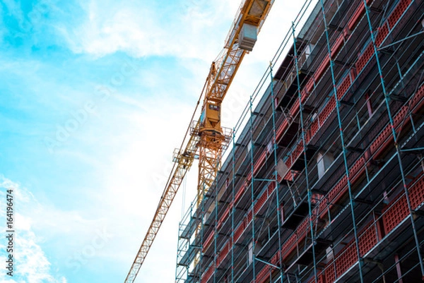 Fototapeta Construction crane on construction site. Building. Skyscraper