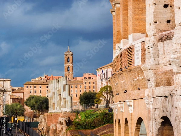 Fototapeta Rome historical center with ancient ruins, Capitoline Hill bell tower and the famous Coliseum