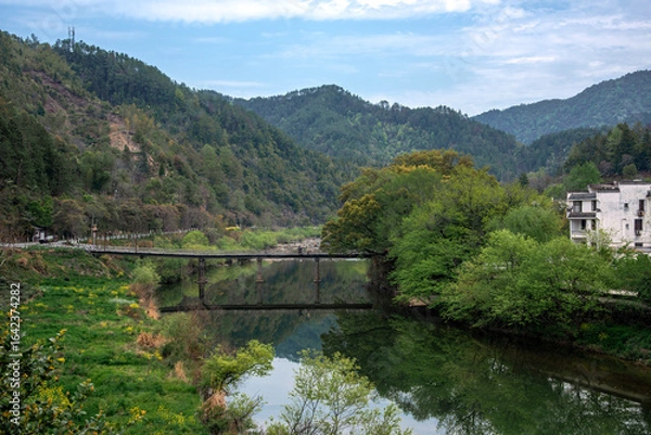 Obraz bridge over the river in the mountains