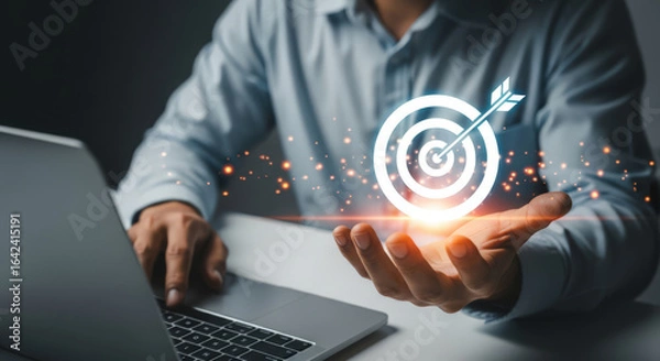 Fototapeta Strategic Goal Achievement Harnessing Technology for Success A Businessman's Hand Presenting a Target Symbolizing Digital Transformation, Innovation, and Progress