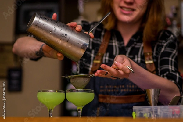 Fototapeta Bartender prepares a cocktail