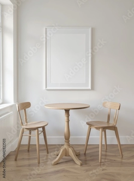 Fototapeta Minimalist dining nook with empty frame and wooden furniture.