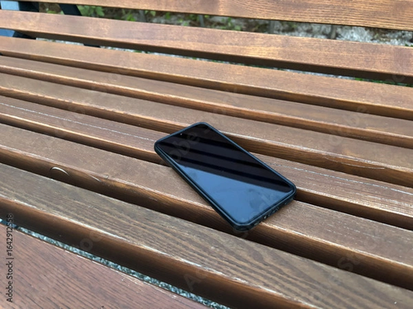 Obraz A phone was lost on a bench at the airport, likely left behind
