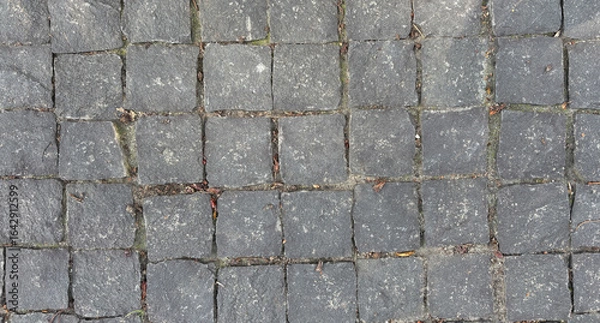 Obraz Old cobblestone road, pavement with rough textured stones