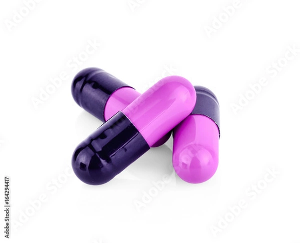 Obraz Purple pill capsule isolated on white background