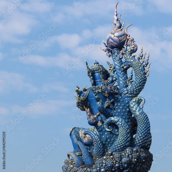 Fototapeta Wat Rong Suea Ten,Ornate architecture, Buddha and figures in the Blue Temple in Chiang Rai, Thailand, Asia