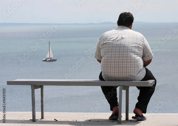Obraz A man sitting on the bench