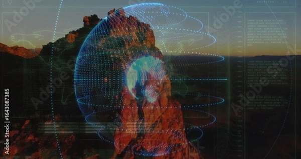 Obraz Displaying rock projecting digital globe with interface schematics streaming data in desert canyon
