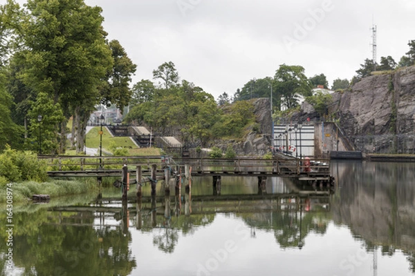 Fototapeta A view at the lock area at the canal Göta kanal in Trollhättan Sweden