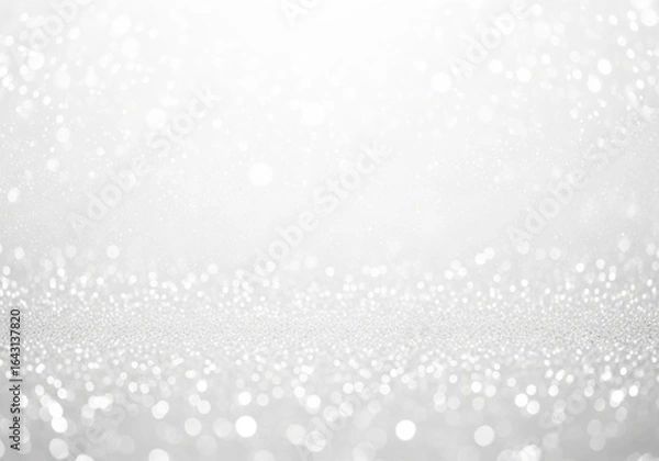 Fototapeta A bright and sparkling white glitter background with bokeh effect, perfect for festive celebrations