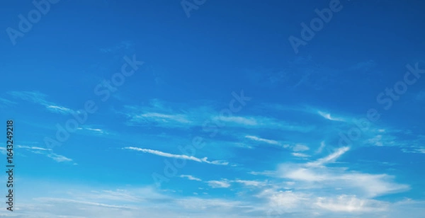 Fototapeta the sky is clear blue with fluffy white clouds, the sky is very bright, and the sun shines.