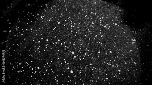 Obraz Black particles on hard metal surface with white shining particles sci-fi background