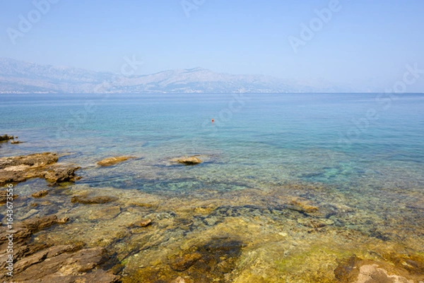 Fototapeta Rocky coast and a view of the Adriatic Sea in Postira on the island of Brac. Croatia