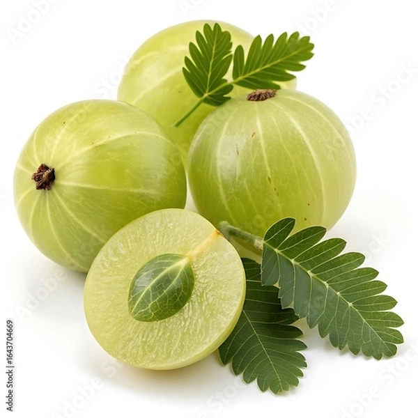 Fototapeta Four light green amla berries with leaves one cut in half