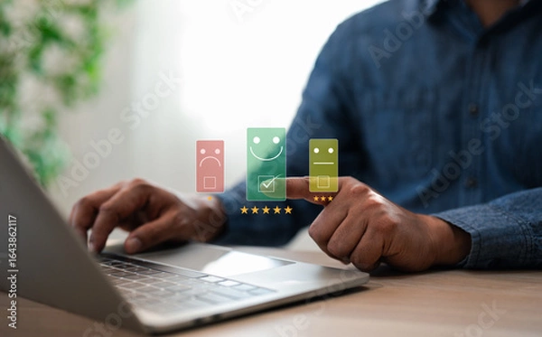 Fototapeta A user give rating to service experience on laptop online application, Evaluate quality of service leading to reputation ranking of business. Customer review satisfaction feedback survey concepts.