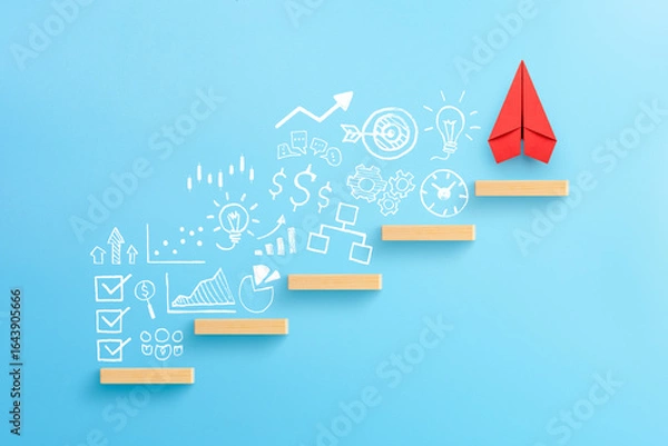 Obraz Wooden block stacking as step stair with red paper plane and business strategy on blue background, Ladder of success in business growth concept.