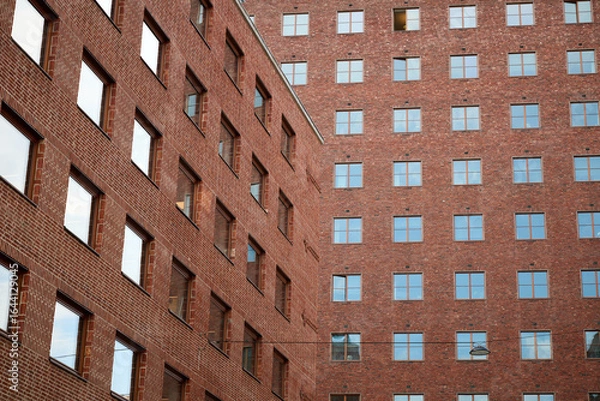 Obraz Red Brick Facade of Oslo City Hall with Repeating Window Patterns and Strong Geometric Lines in Urban Courtyard View