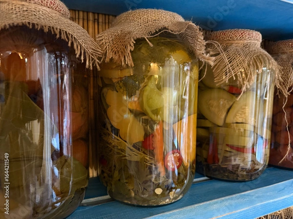 Obraz Jar of vegetable assortment on restaurant shelf