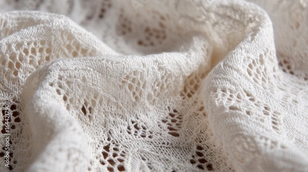 Fototapeta A white lace fabric with a pattern of flowers and leaves